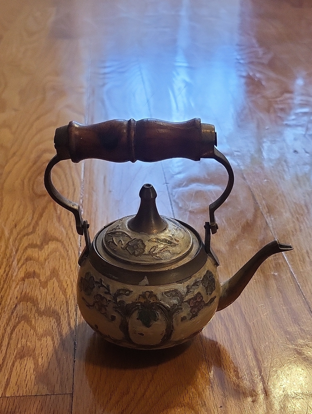 Ornate Brown Metal Teapot with Wooden Handle